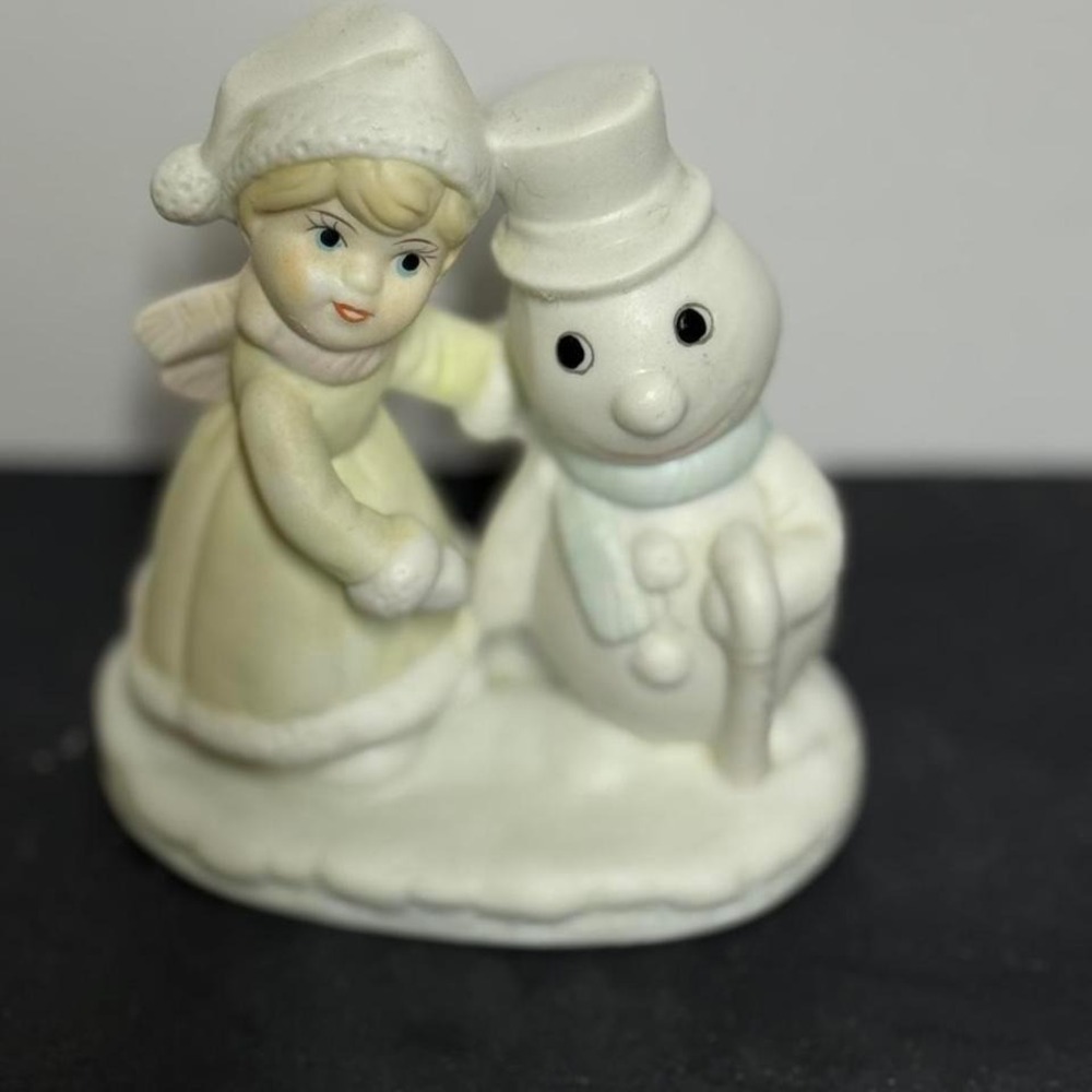 White porcelain snowman figurine